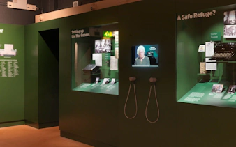 Churchill War Rooms Museum exhibit with historical displays and interactive screens.