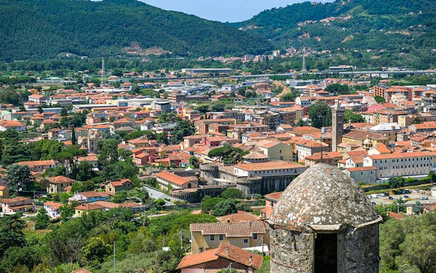 Panoramic view from Sarzanello fortress walls over Sarzana, Spezia, showcasing town and hills.