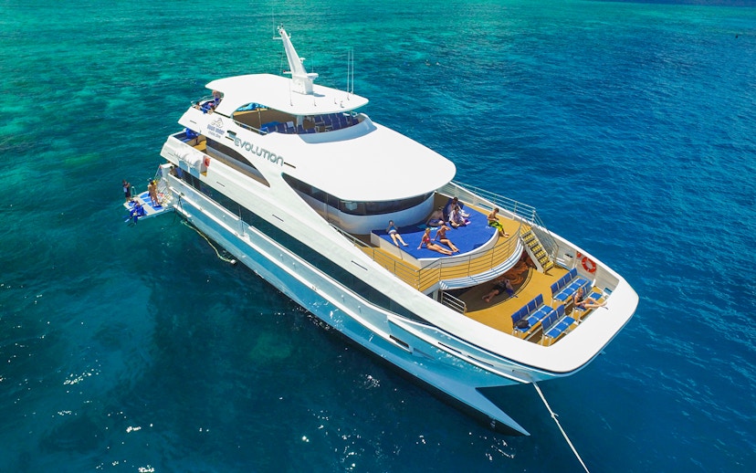 Tourists relaxing on a cruise ship deck in the Great Barrier Reef, Australia.