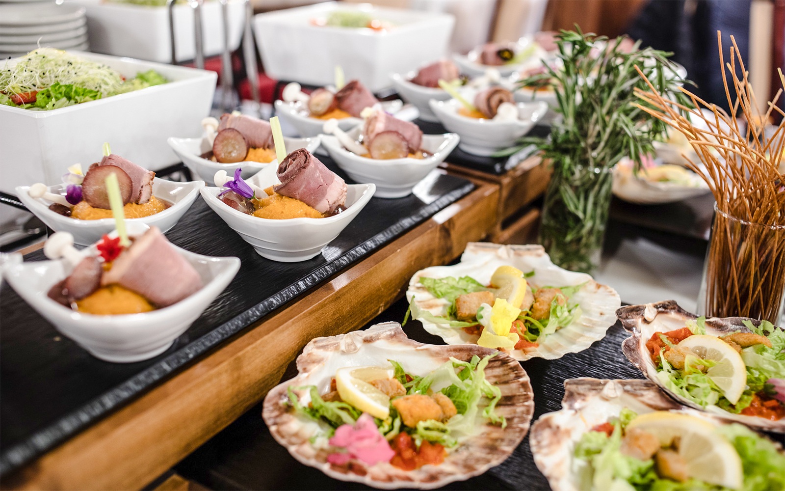 Buffet dishes with assorted meats and salads on a Danube sightseeing dinner cruise.