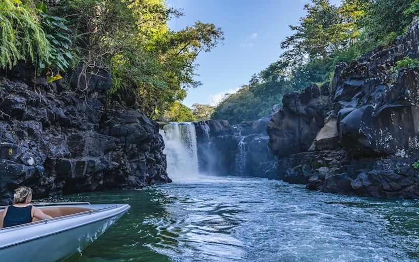 Boat approaching Grand River South East waterfall, Mauritius.