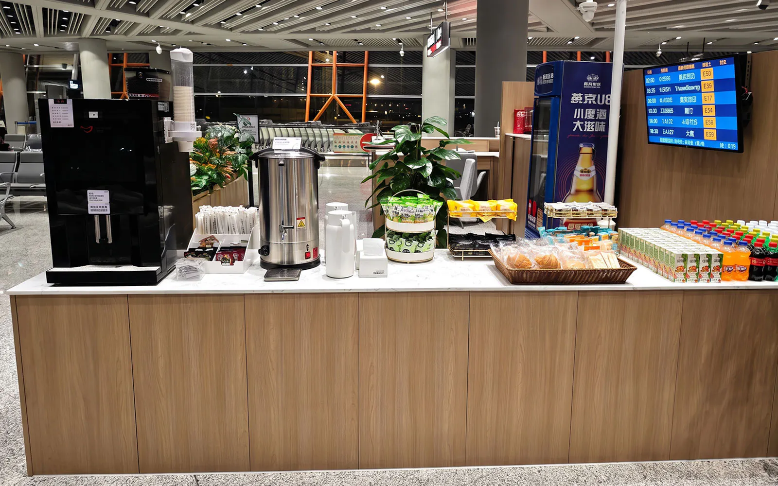 Refreshment counter with drinks and snacks at Terminal 3, Beijing Capital Airport.