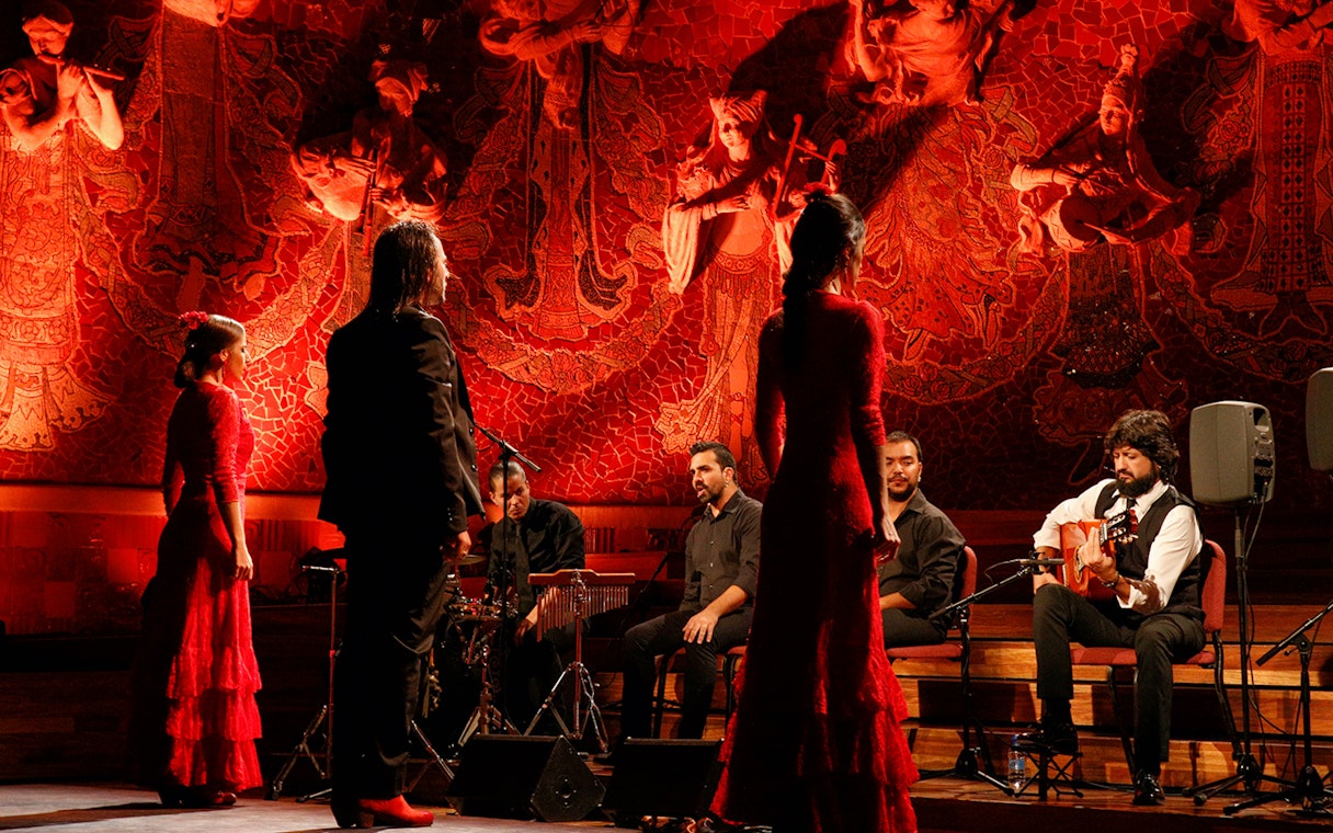 Flamenco performers on stage at Poliorama Theater, Barcelona.