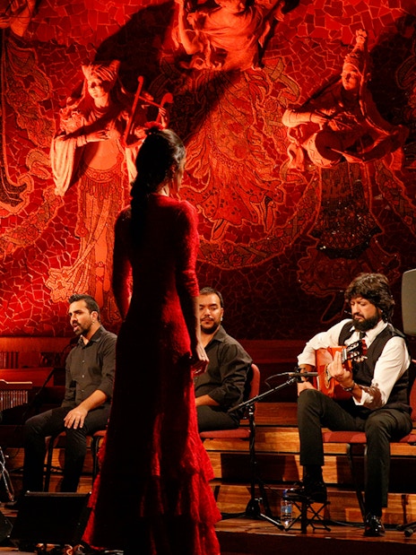 Flamenco performers on stage at Poliorama Theater, Barcelona.