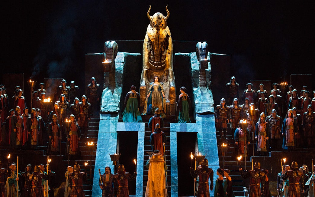 Opera performance of Nabucco with cast in ancient costumes on stage.