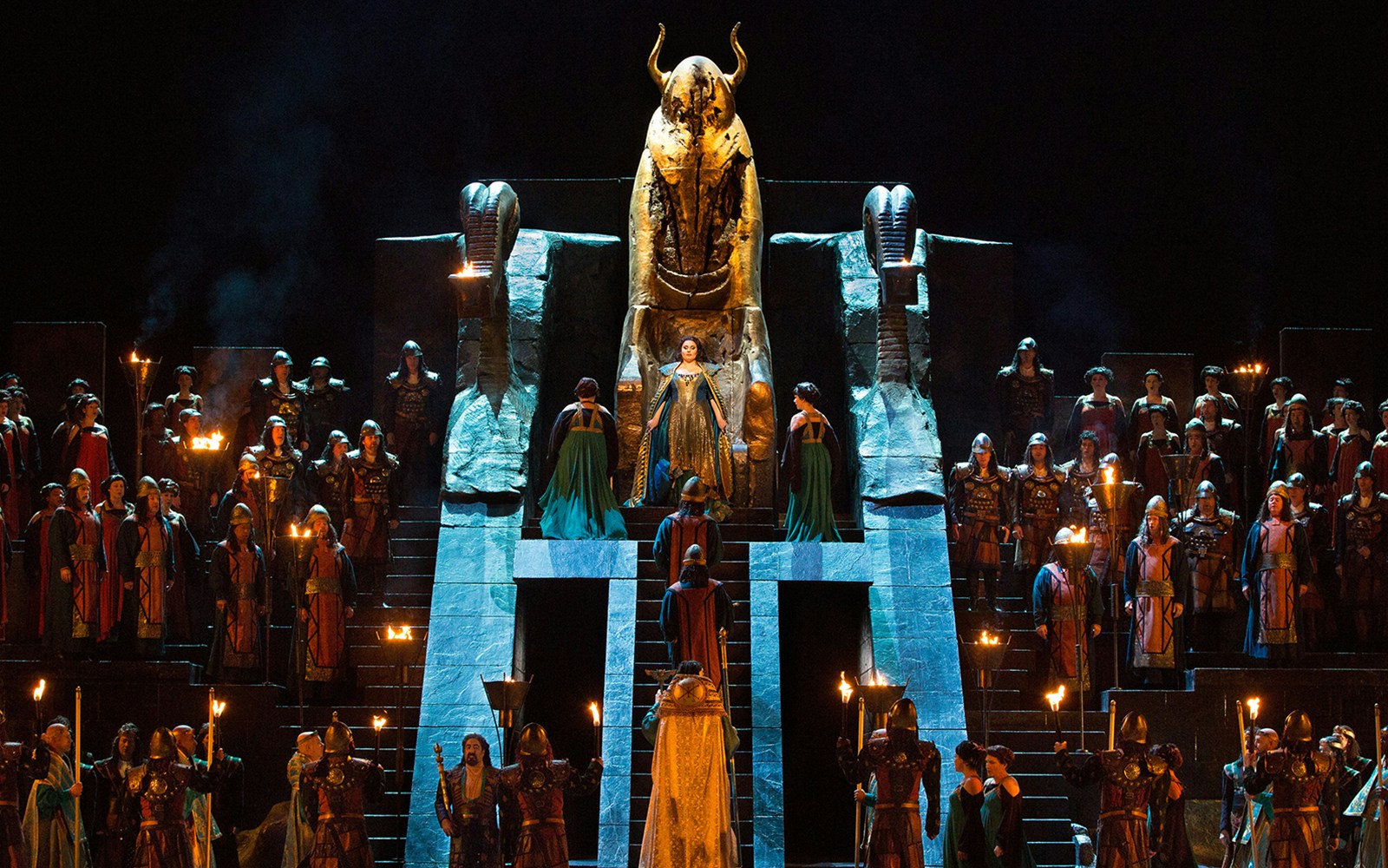 Opera performance of Nabucco with cast in ancient costumes on stage.