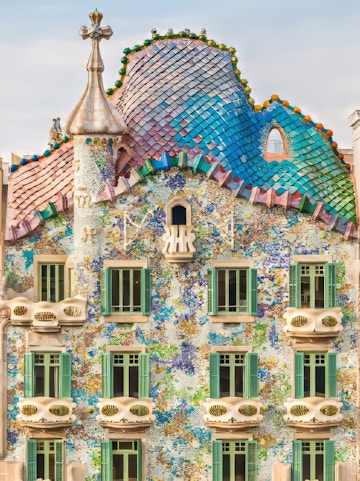 Casa Batllo facade with colorful mosaics and unique architecture in Barcelona.