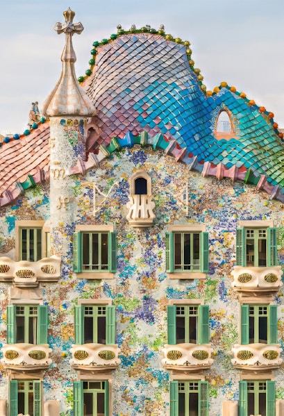 Casa Batllo facade with colorful mosaics and unique architecture in Barcelona.