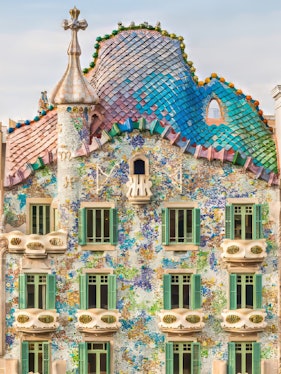 Casa Batllo facade with colorful mosaics and unique architecture in Barcelona.
