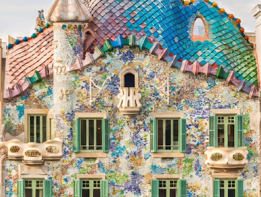 Casa Batllo facade with colorful mosaics and unique architecture in Barcelona.
