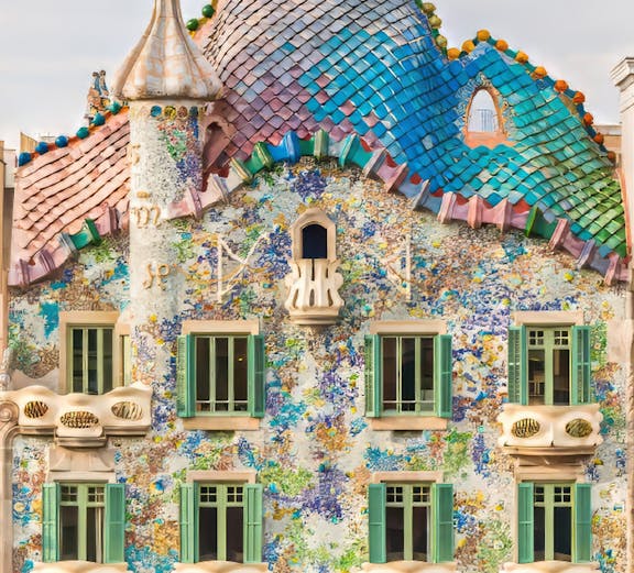 Casa Batllo facade with colorful mosaics and unique architecture in Barcelona.