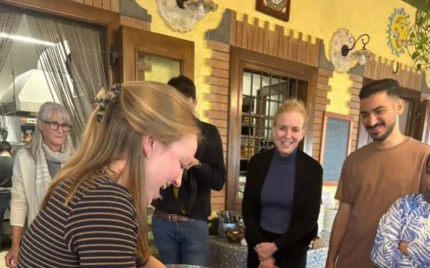 Cooking class participants making pasta at an Amalfi Coast farmhouse.