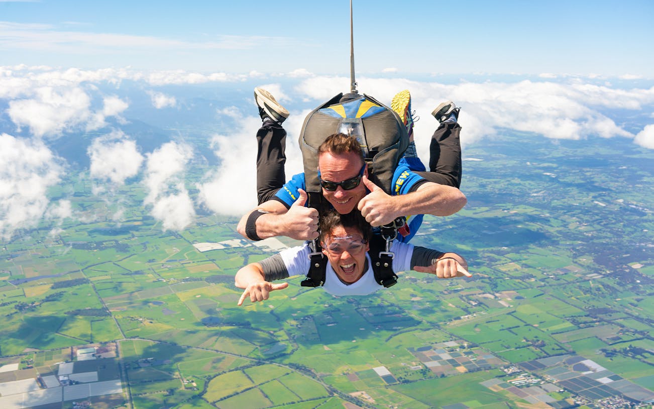Tandem skydive over Yarra Valley, Melbourne at 15,000ft with clear sky and landscape view.