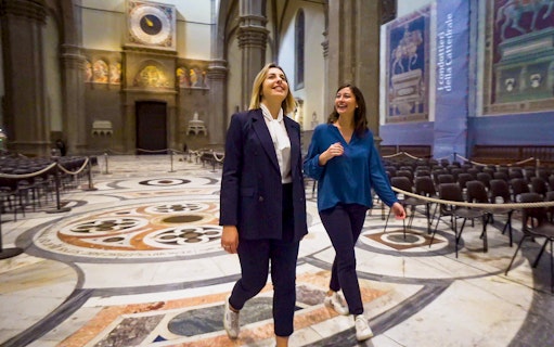 Visitors exploring the interior of Florence Cathedral on a guided tour.
