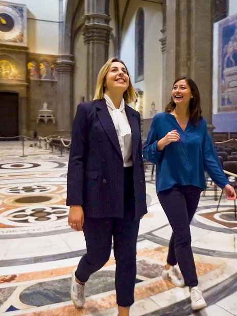 Visitors exploring the interior of Florence Cathedral on a guided tour.