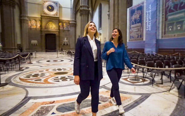 Visitors exploring the interior of Florence Cathedral on a guided tour.
