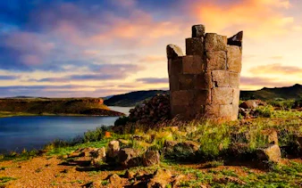 Sillustani Burial Tower near Lake Umayo at sunset, Puno, Peru.