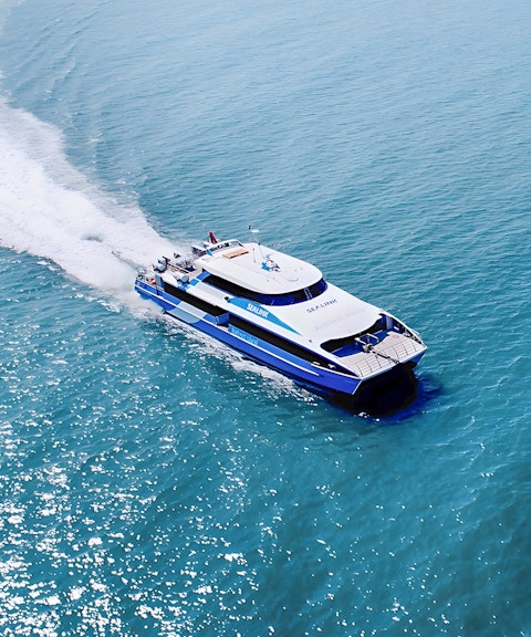 Ferry approaching Rottnest Island with ocean view, part of the guided bus tour from Perth or Fremantle.