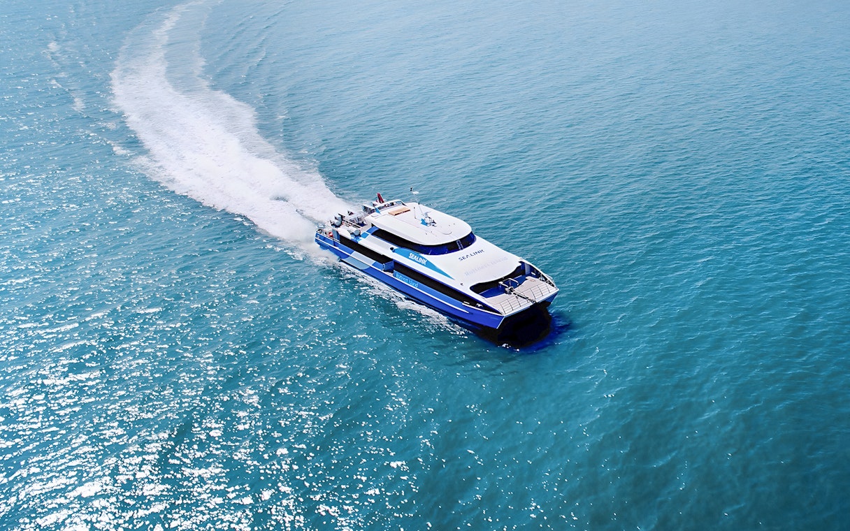 Ferry approaching Rottnest Island with ocean view, part of the guided bus tour from Perth or Fremantle.