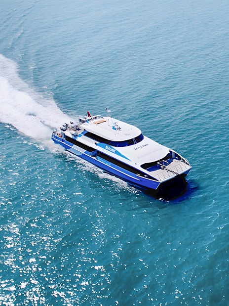Ferry approaching Rottnest Island with ocean view, part of the guided bus tour from Perth or Fremantle.