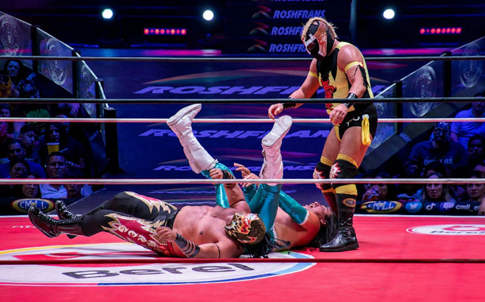 Wrestlers in action at Arena Mexico Lucha Libre event.