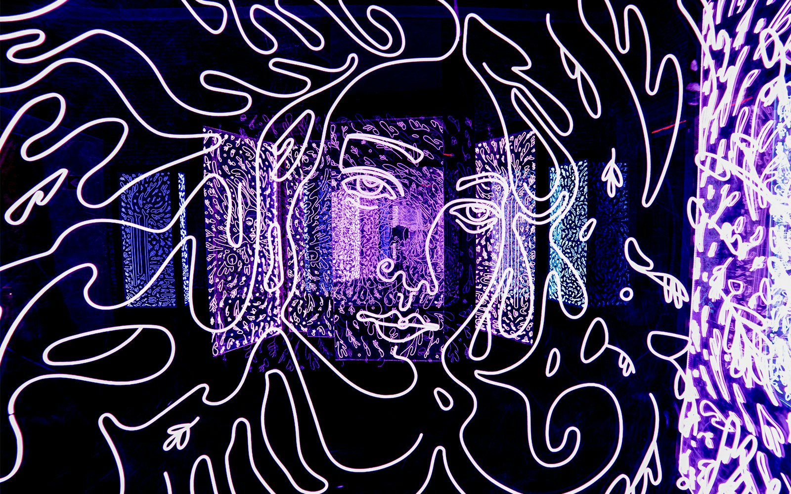 Visitors exploring interactive art installations at Ikono Madrid.