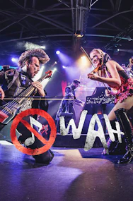 Musicians performing energetically on stage with string instruments, WAH tour.