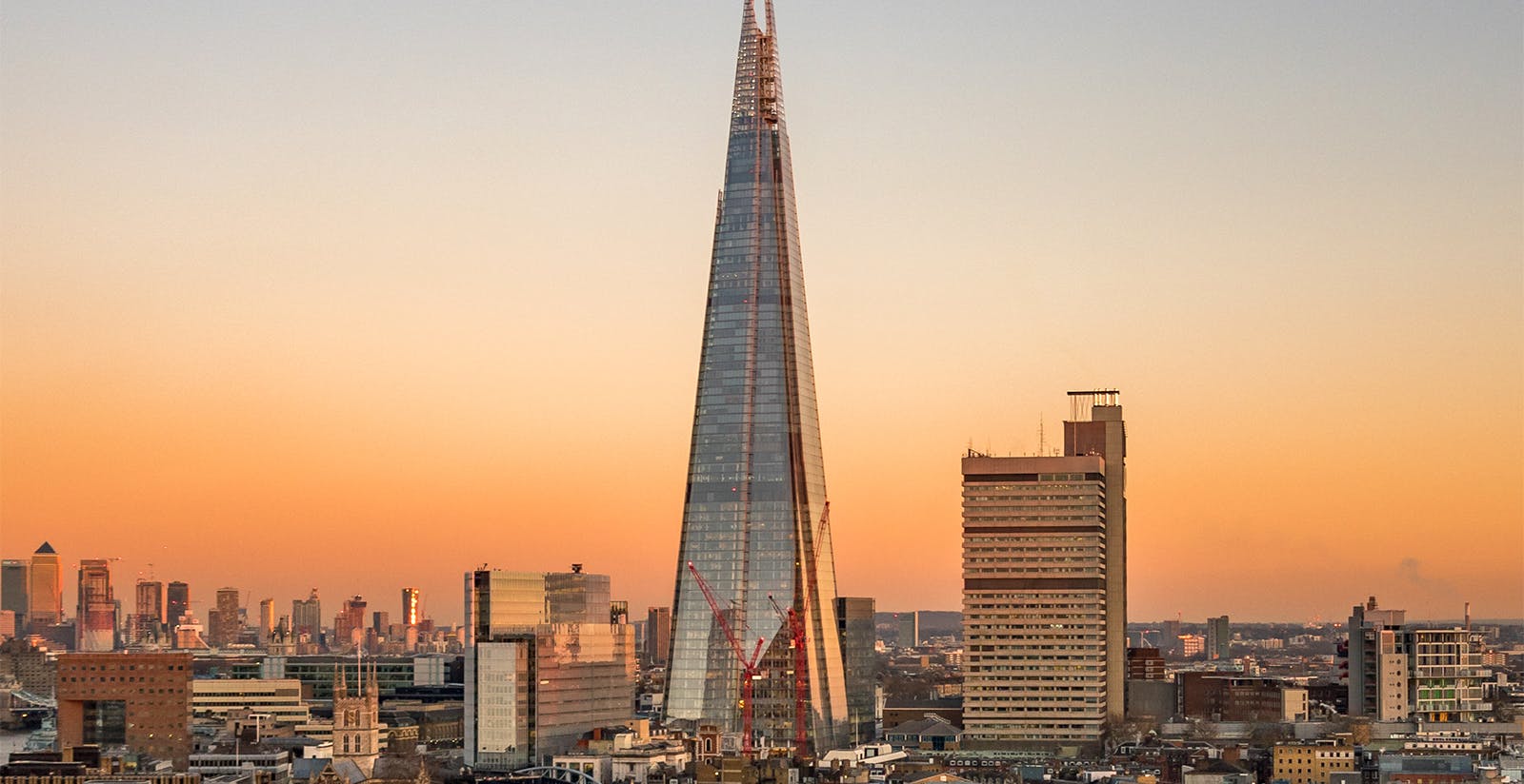 View of the Shard in London at sunset with cityscape in the background