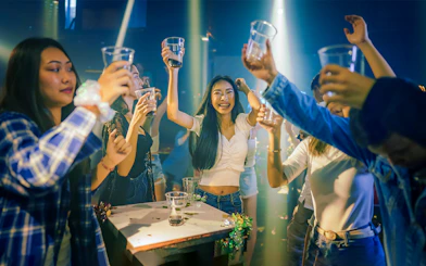 Group enjoying drinks during a Singapore pub crawl.