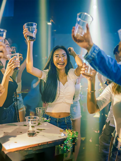 Group enjoying drinks during a Singapore pub crawl.