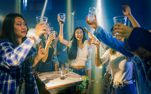 Group enjoying drinks during a Singapore pub crawl.