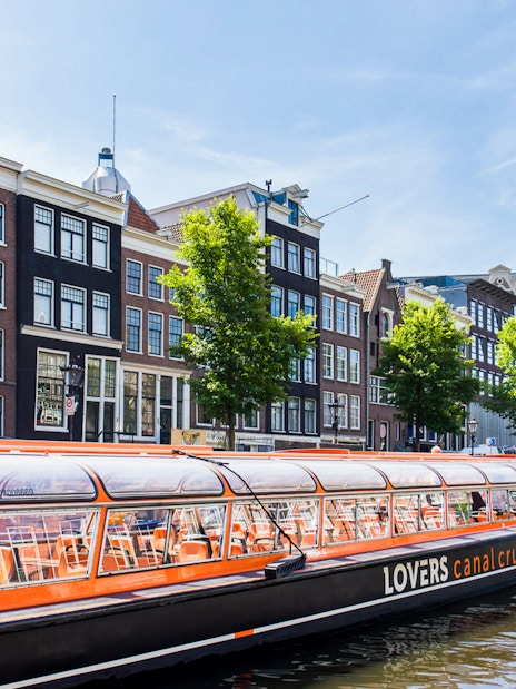 Canal cruise passing Westerkerk Church in Amsterdam.