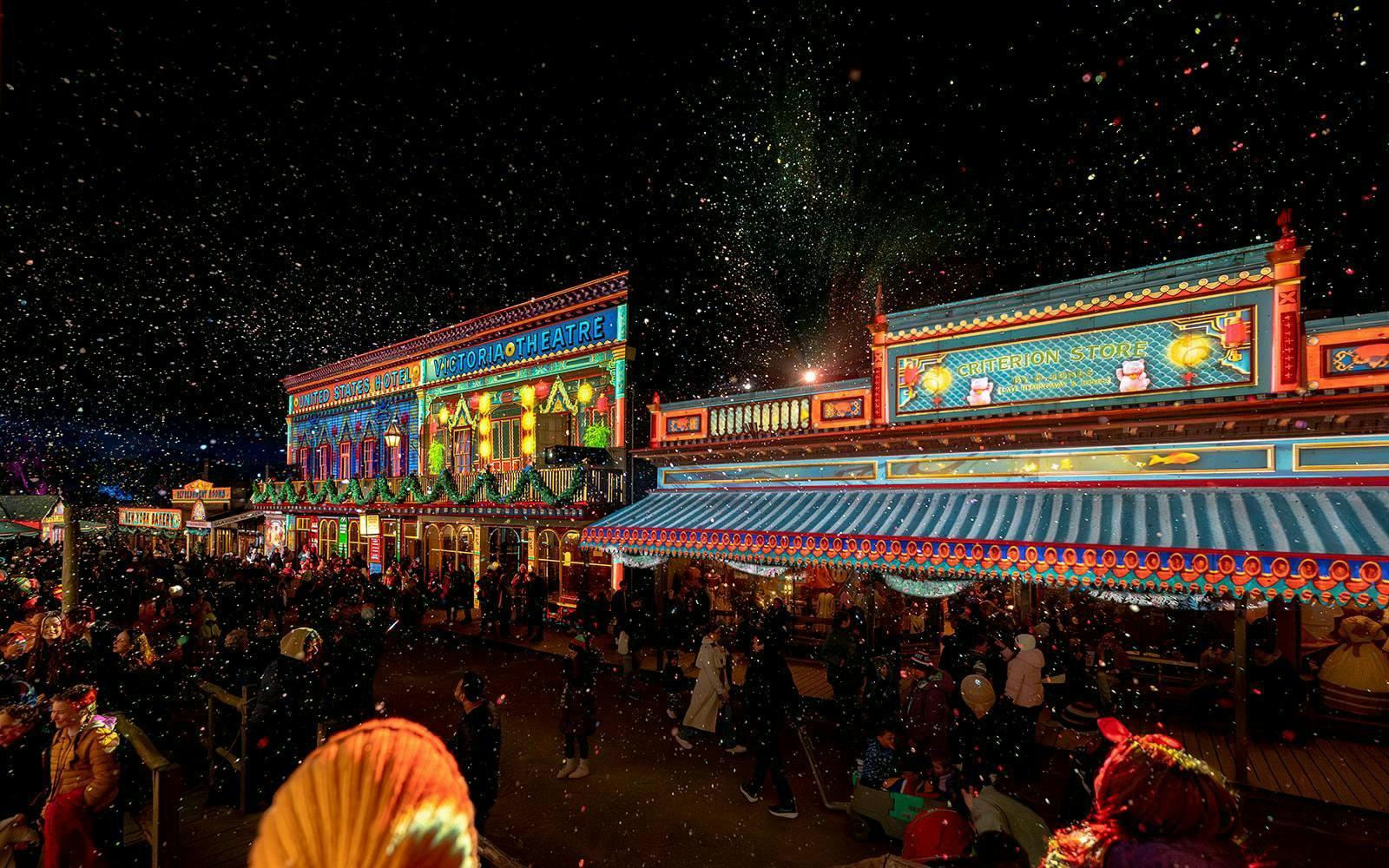 Sovereign Hill Winter Wonderlights festival with illuminated buildings and festive crowd.