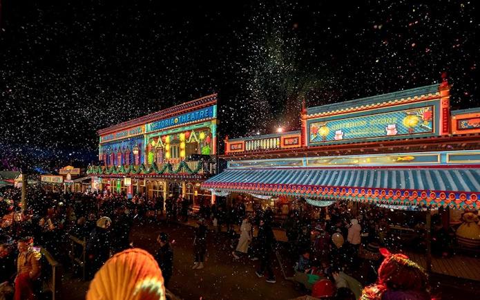 Sovereign Hill Winter Wonderlights festival with illuminated buildings and festive crowd.