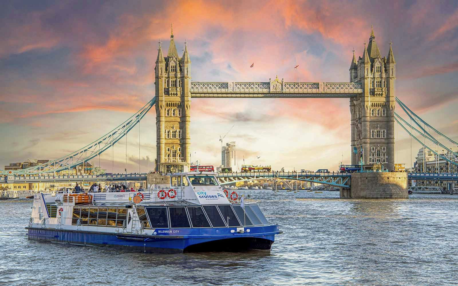 River Thames dinner cruise with festive Christmas lights illuminating London landmarks.