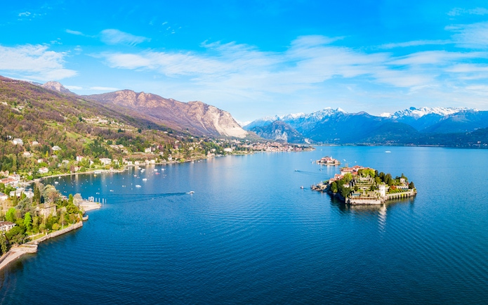 Aerial view of Isole Borromee on Lake Maggiore with mountains in the background.