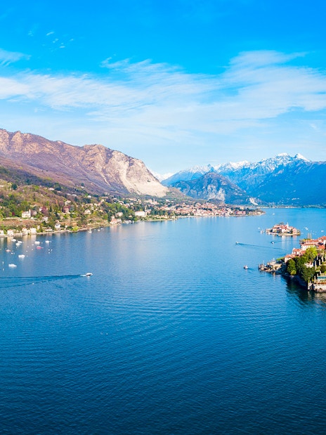Aerial view of Isole Borromee on Lake Maggiore with mountains in the background.