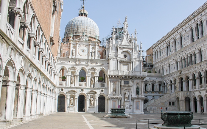 Courtyard of Doge's Palace, Venice, featuring ornate architecture and statues.