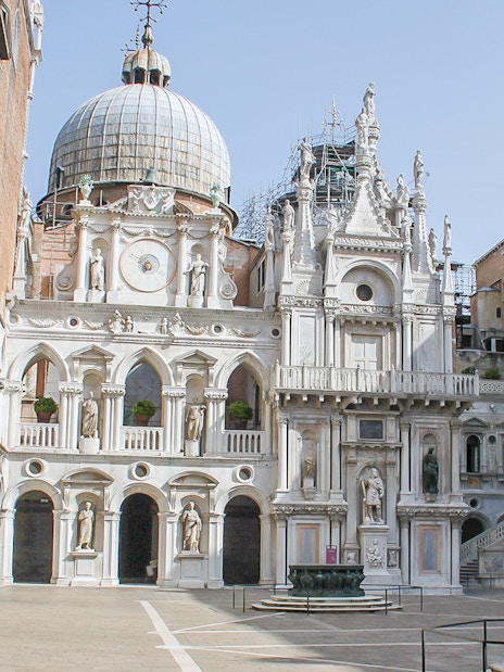 Courtyard of Doge's Palace, Venice, featuring ornate architecture and statues.