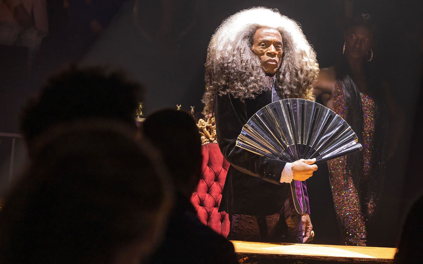 Performer with a fan during CATS: The Jellicle Ball Broadway show.