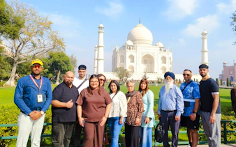 Group of tourists in front of the Taj Mahal during a 2-day private Agra trip from Delhi.