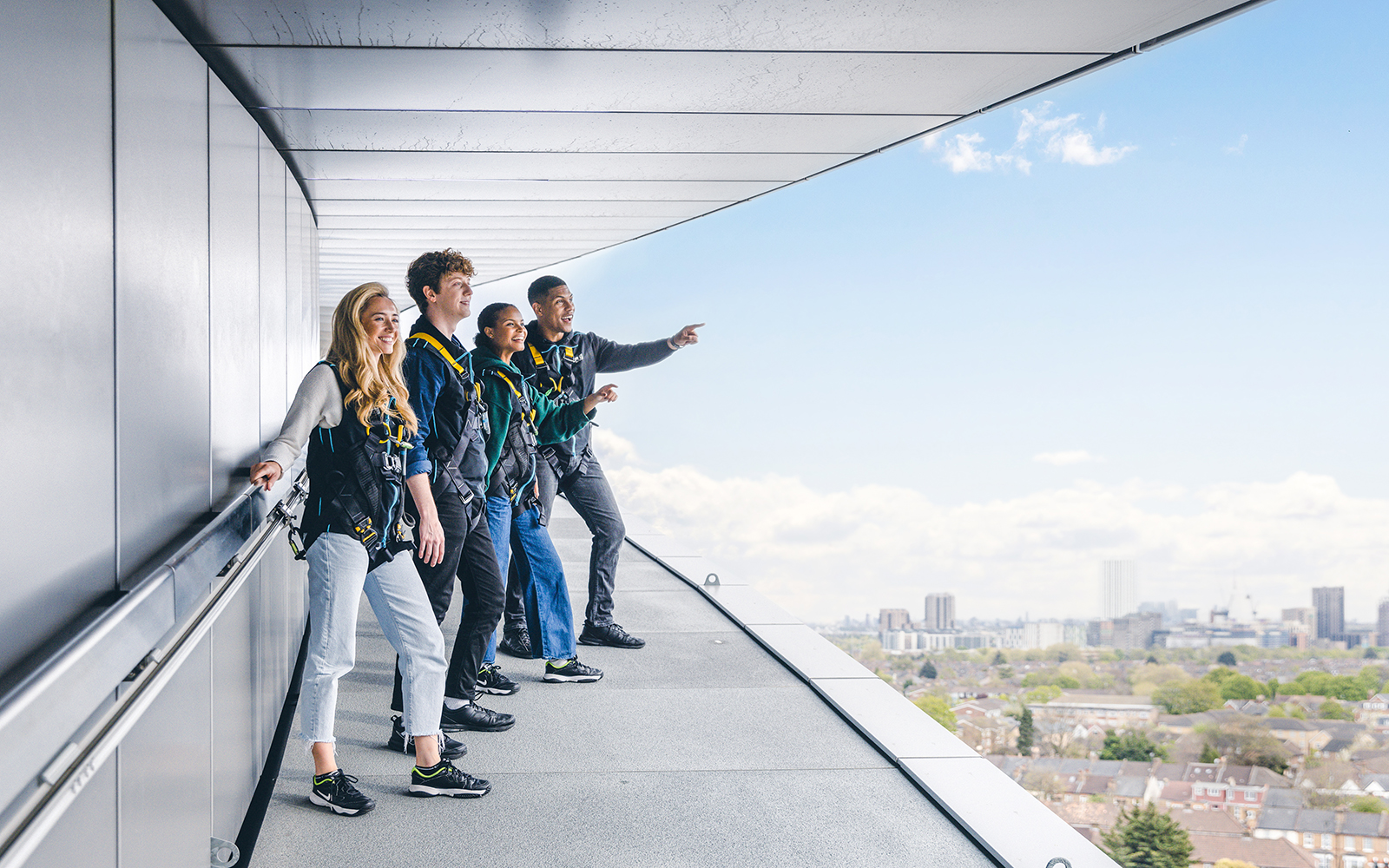 Visitors enjoying the view from The Dare Skywalk in London.