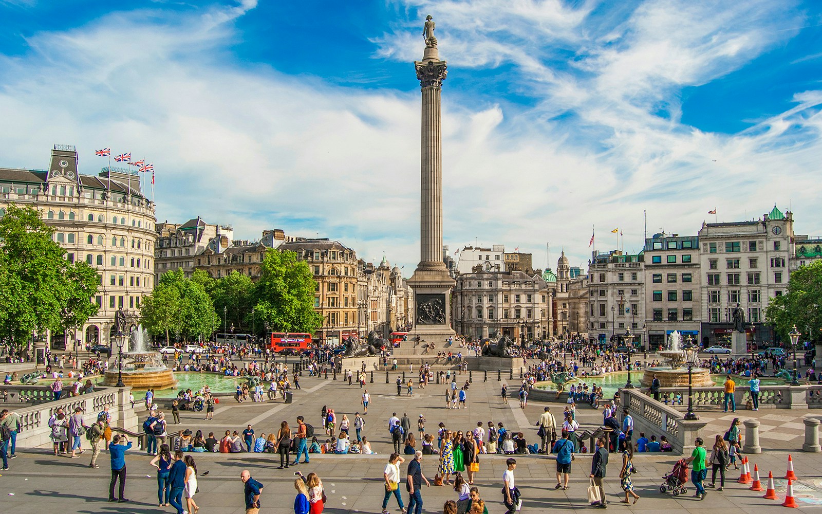 Tourists at Trafalgar Square on Westminster walking tour, London.