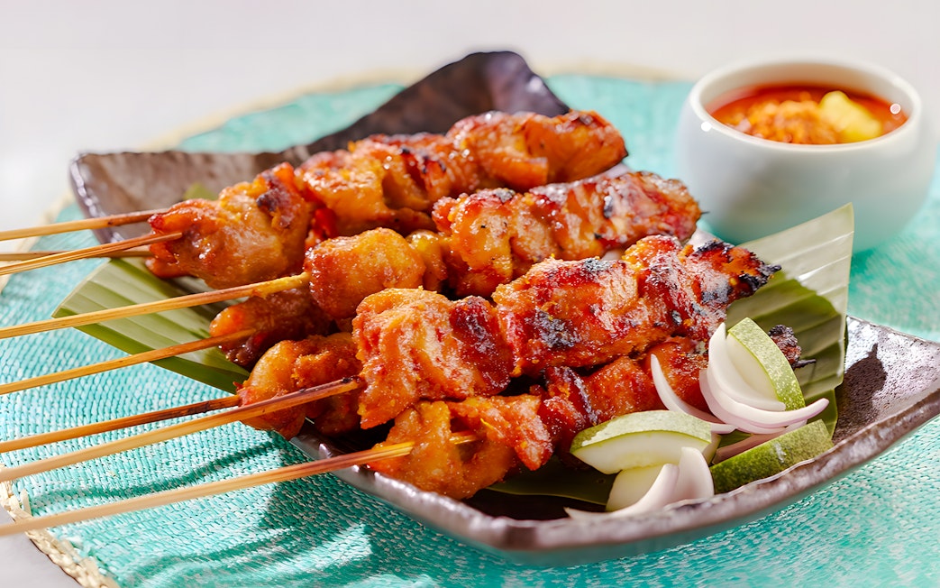 Skewers at House of Seafood, Clarke Quay, Singapore with dipping sauce.