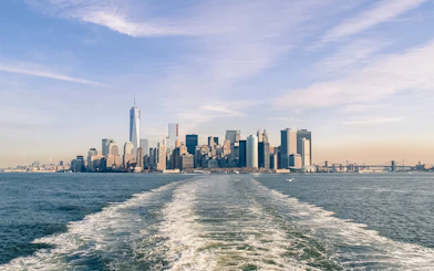 New York City skyline from Statue of Liberty Ellis Island sunset cruise.