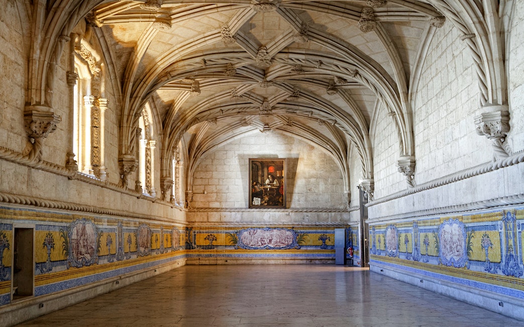 Jerónimos Monastery interior with vaulted ceilings and azulejo tiles, Lisbon, Portugal.
