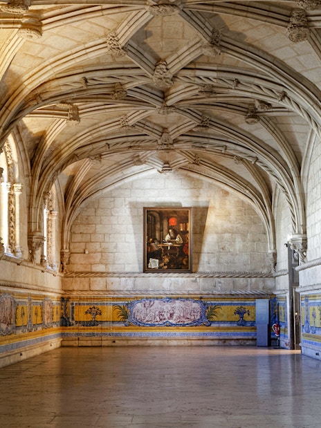 Jerónimos Monastery interior with vaulted ceilings and azulejo tiles, Lisbon, Portugal.