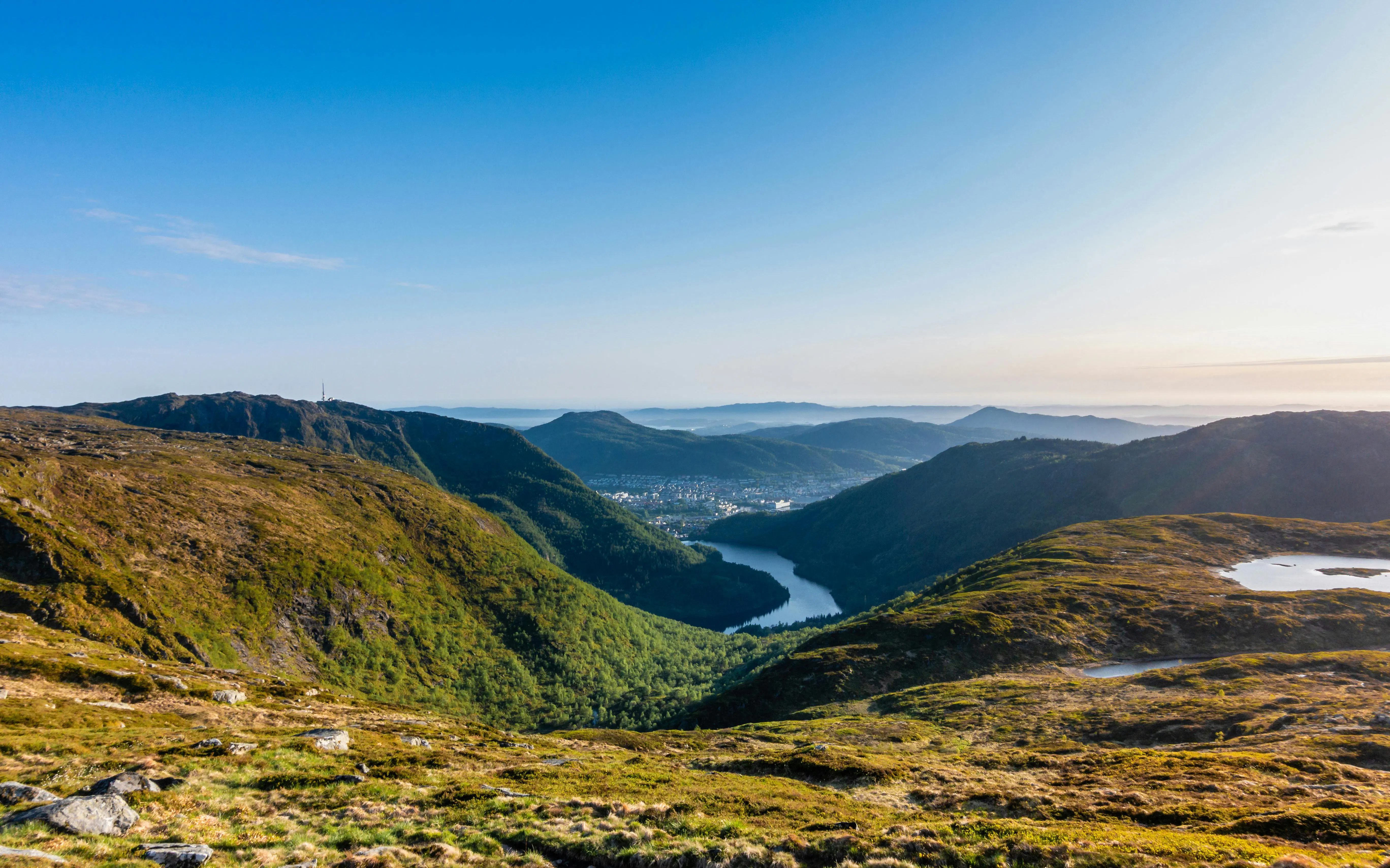 Mountaintop view from Mount Ulriken overlooking a valley leading to Bergen, Norway on the Vidden Hiking Trail.