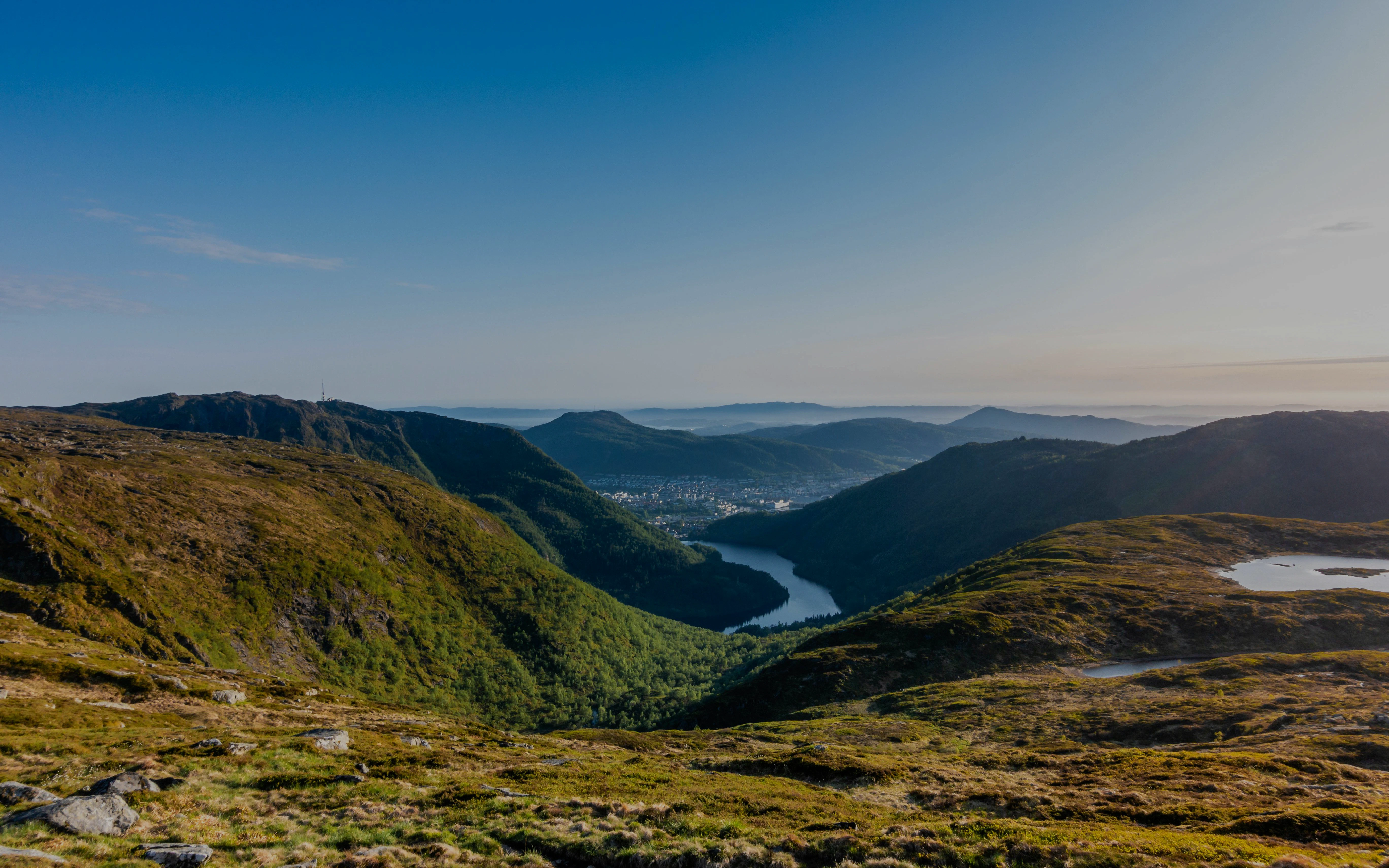 Mountaintop view from Mount Ulriken overlooking a valley leading to Bergen, Norway on the Vidden Hiking Trail.