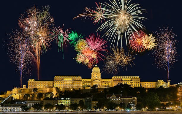 Fireworks over Buda Castle during a Budapest cruise.